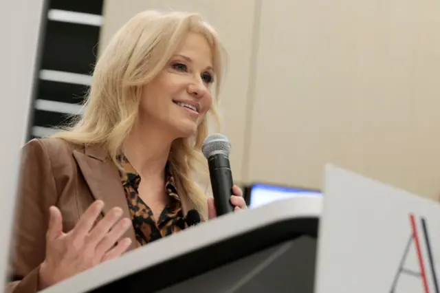 Photo of Kellyanne Conway speaking into a microphone