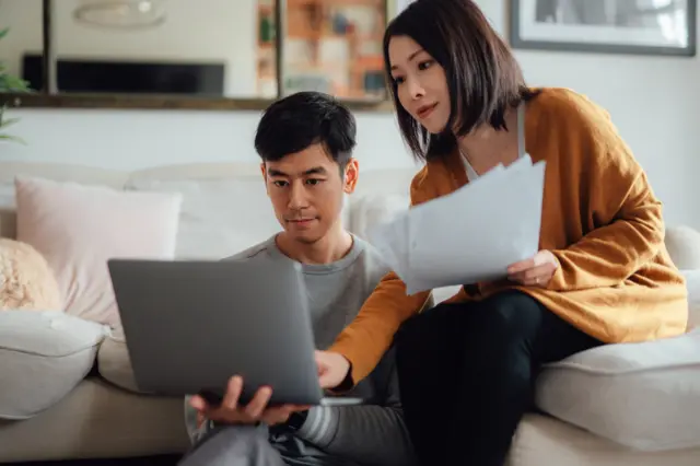 Young couple looking at bills