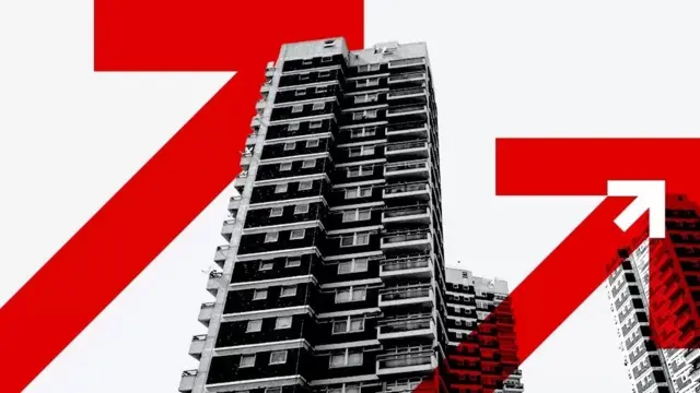 A block of flats with upward arrow graphics