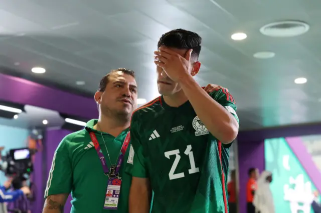 Uriel Antuna of Mexico is consoled after the FIFA World Cup Qatar 2022 Group C match between Saudi Arabia and Mexico at Lusail Stadium