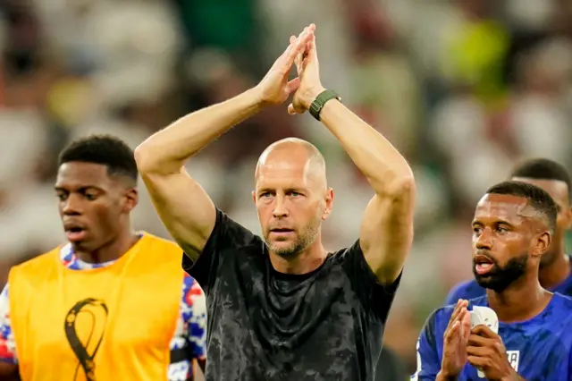 Gregg Berhalter applauding the USA fans after the game