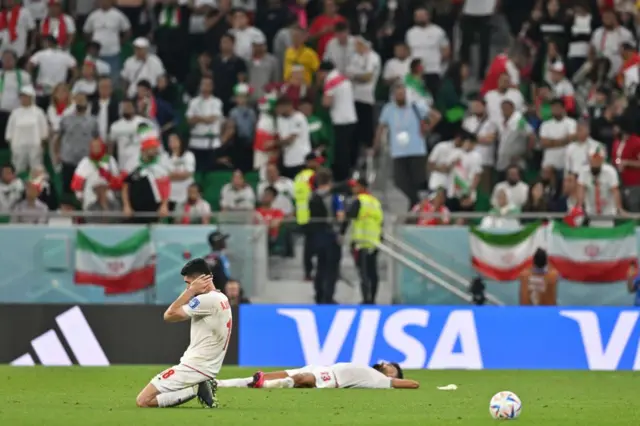 Iran players on the floor at the final whistle