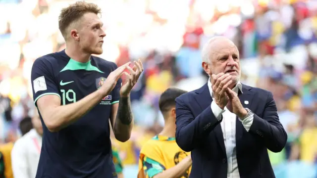 Graham Arnold celebrates Australia's win over Tunisia