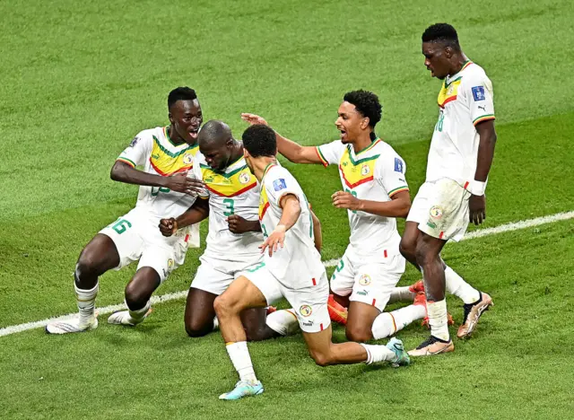 Senegal players congratulate Kalidou Koulibaly on his goal