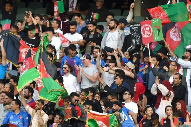 Afghanistan fans celebrate a wicket