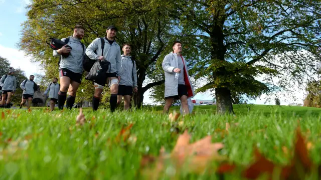 Wales players walk to training