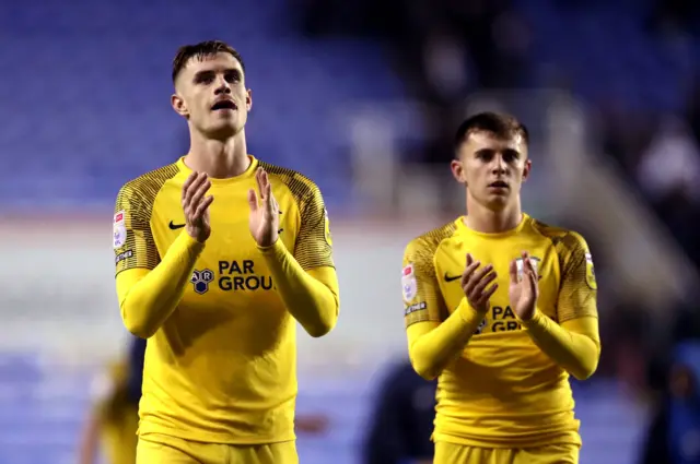 Preston players applaud their supporters