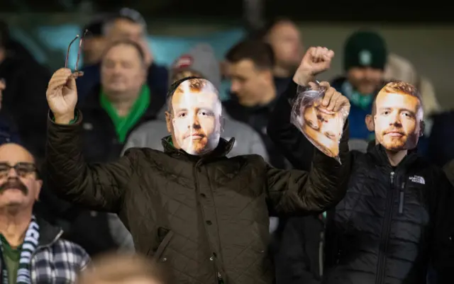 Hibernian fans in Ryan Porteous masks