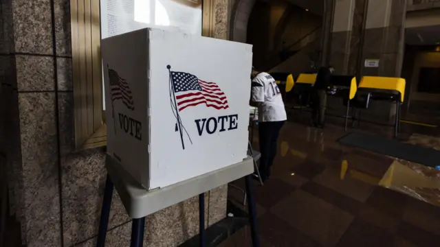 A signs reads 'Vote' as electors cast their ballots for the mid term elections at the Union Station polling station in Los Angeles, California