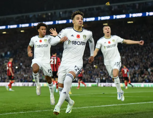 Rodrigo celebrates scoring penalty with teammates