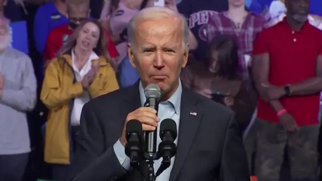 Biden speaks into a mic at Pennsylvania rally