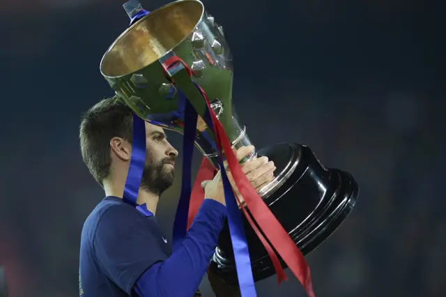 Gerard Pique with trophy