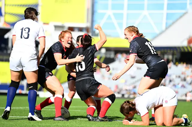 Alysha Corrigan of Canada celebrate