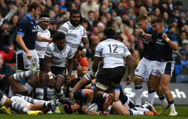 George Turner scores the first try of the game