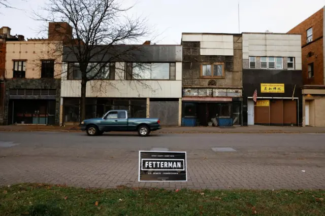 A campaign sign for Democratic US Senate candidate John Fetterman is seen in Braddock, Pennsylvania