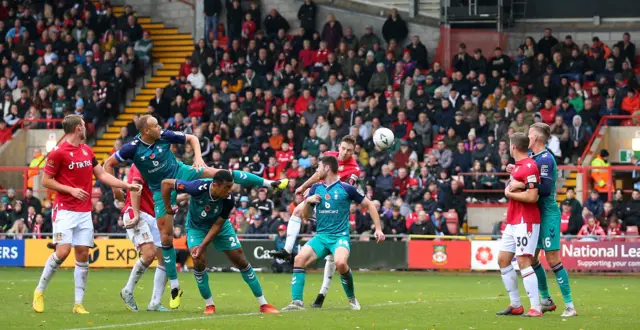 Paul Mullin scores Wrexham's third goal