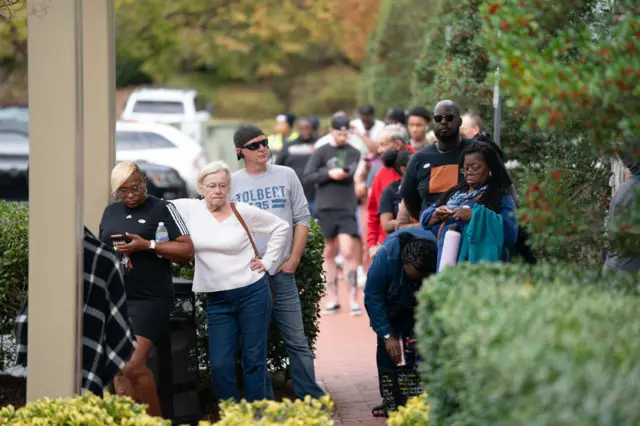 People wait in line for early voting just before polls close at a voting location on November 5, 2022 in Charlotte, North Carolina.