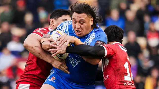 Josh Papali'i of Samoa tackled