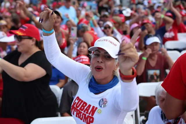 A woman wearing a "Cuban for Trump" for shirt