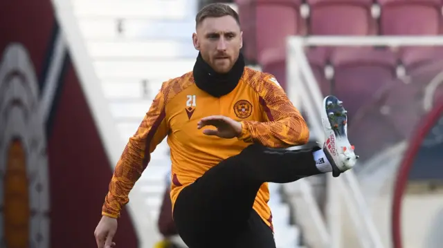 Motherwell striker Louis Moult warms up at Tynecastle