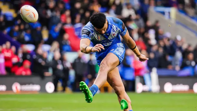 Stephen Crichton kicks a goal