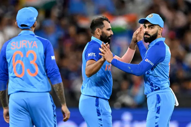 Mohammad Shami and India celebrate a wicket