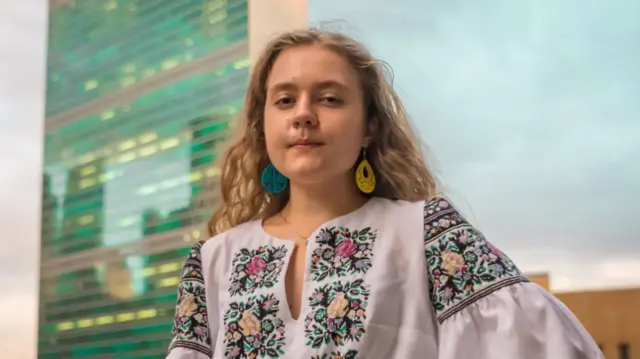 Viktoriya in a traditional blouse embroidered by her grandmother