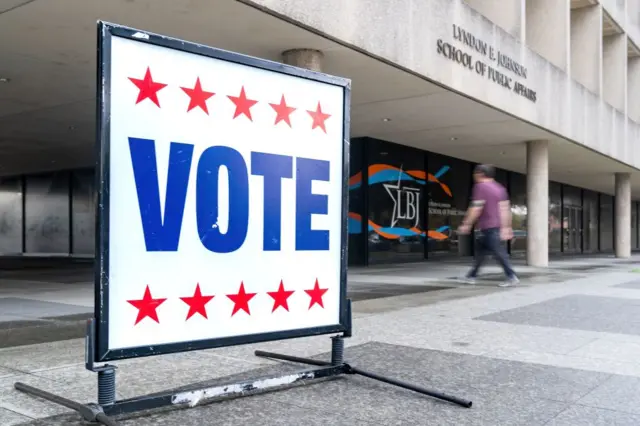 A 'vote' sign outside of the Lyndon B. Johnson School of Public Affairs in Austin, Texas.