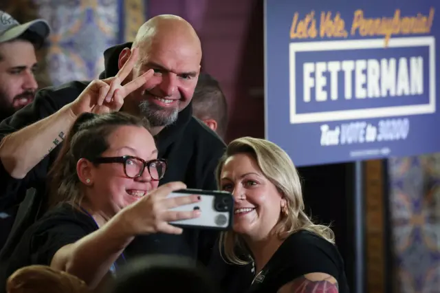 Democrat Senate candidate for Pennsylvania, John Fetterman, poses with supports after a campaign event in Harrisburg, Pennsylvania