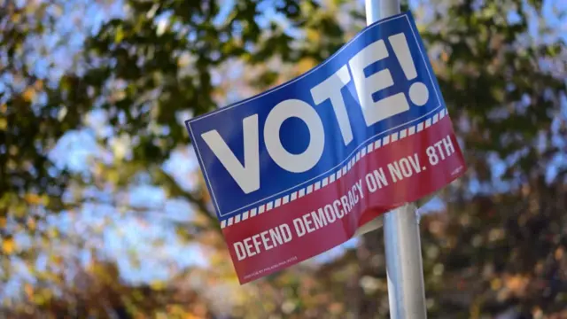 A sign saying vote