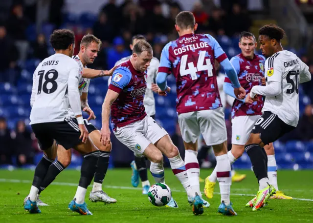 Burnley's Ashley Barnes tries to turn in the penalty area during the Carabao Cup Third Round match between Burnley and Crawley Town at Turf Moor