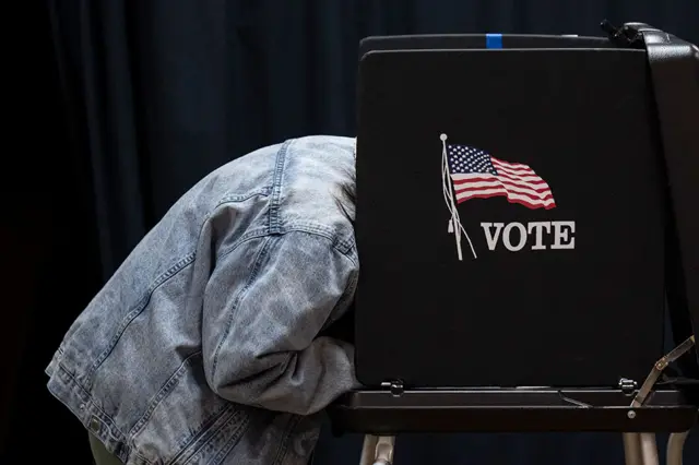 People vote at a polling location at Indianola Church of Christ on Election Day on 8 November 2022 in Columbus, Ohio, USA