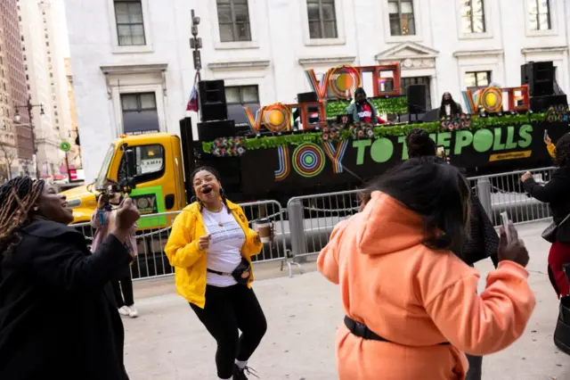 People dance as Questlove plays music outside of Philadelphia's City Hall