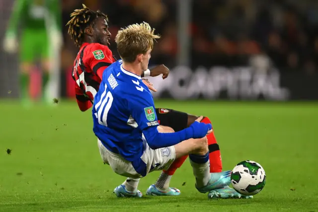 Anthony Gordon of Everton is challenged by Jordan Zemura of AFC Bournemouth during the Carabao Cup Third Round match