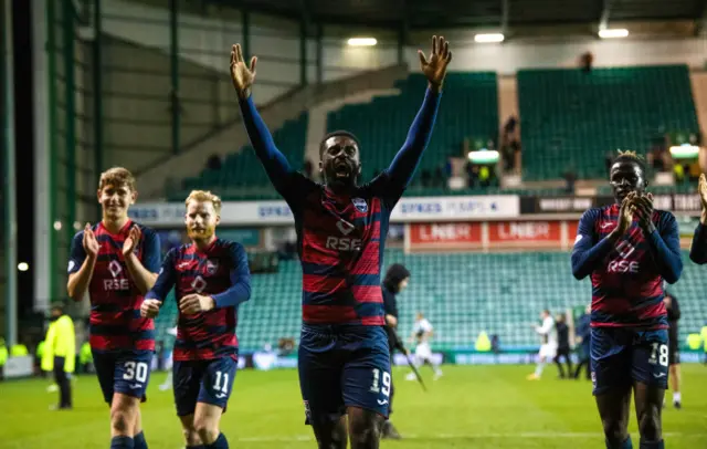 Ross County players celebrate with their small band of fans
