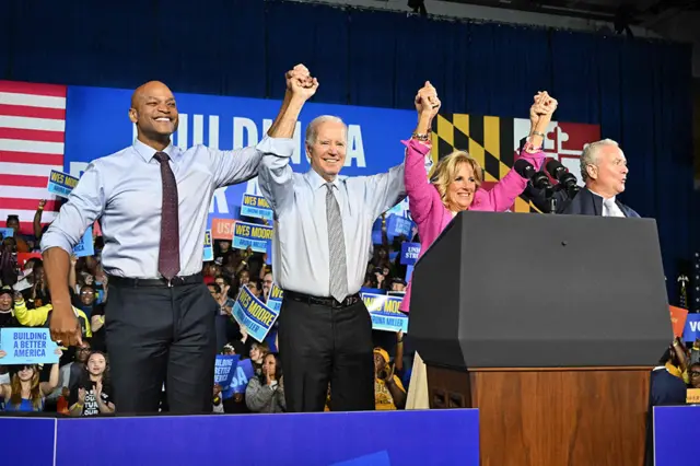 (left to right) Gubernatorial candidate Wes Moore, US President Joe Biden, US First Lady Jill Biden and US Senator Chris Van Hollen acknowledge the crowd during a rally on the eve of the US midterm elections at Bowie State University in Bowie, Maryland, on 7 November 2022