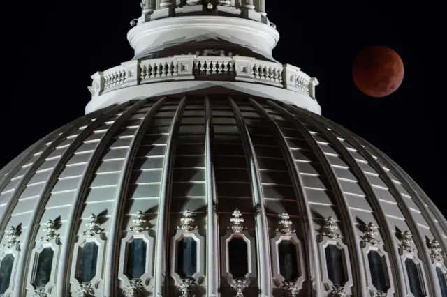 The blood moon lunar eclipse photographed by the US Capitol dome.