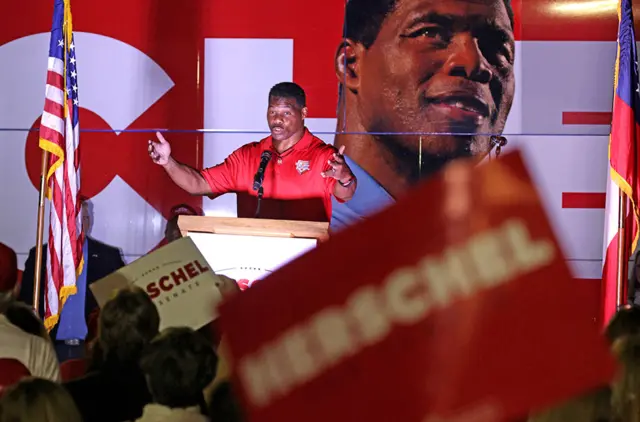 Republican US Senate candidate Herschel Walker speaks at a campaign rally on 7 November 2022 in Kennesaw, Georgia