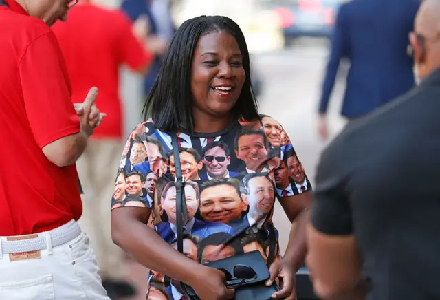 A supporter wears a shirt covered with photos of Florida Governor Ron DeSantis at a rally for Florida Republicans at the Cheyenne Saloon on 7 November 2022 in Orlando, Florida