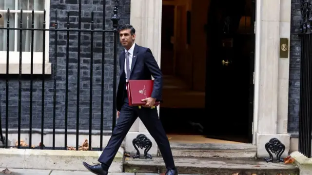 British Prime Minister Rishi Sunak walks outside Number 10 Downing Street, in London, Britain, November 9, 2022.