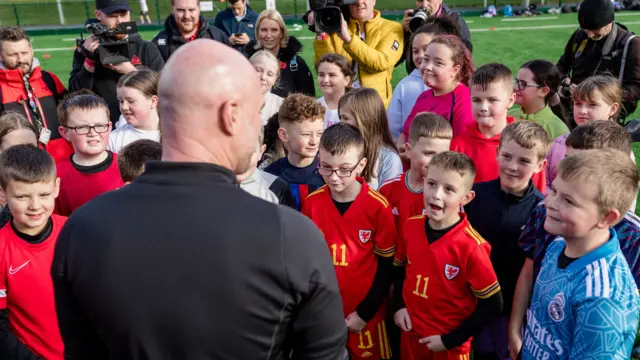 Rob Page talking to school kids