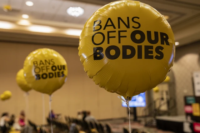 Balloons that read 'bans off our bodies'