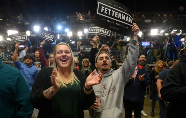 Supporters of Fetterman cheer for him at a campaign rally tonight.