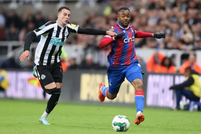 Jordan Ayew and Javi Manquillo compete for the ball