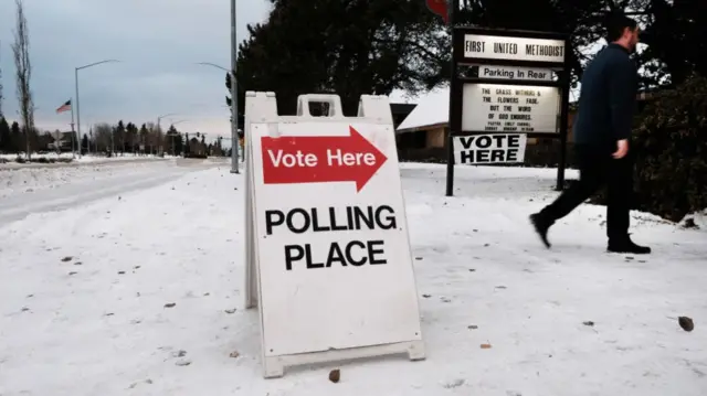 A voter in Anchorage heads into a polling site