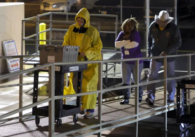 READY: Election workers process polling place equipment and material in Nevada.