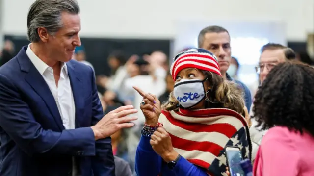 Gavin Newsom speaking to a supporter on Sunday