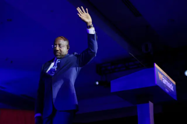 Georgia Senator Raphael Warnock waves to supporters