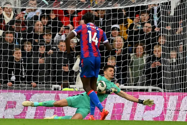 Nick Pope saves a penalty taken by Jean-Philippe Mateta