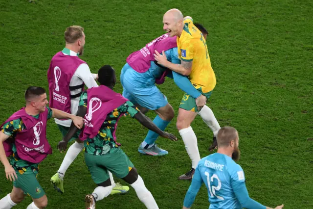 Aaron Mooy and Australia celebrate reaching the last 16 of the Fifa World Cup